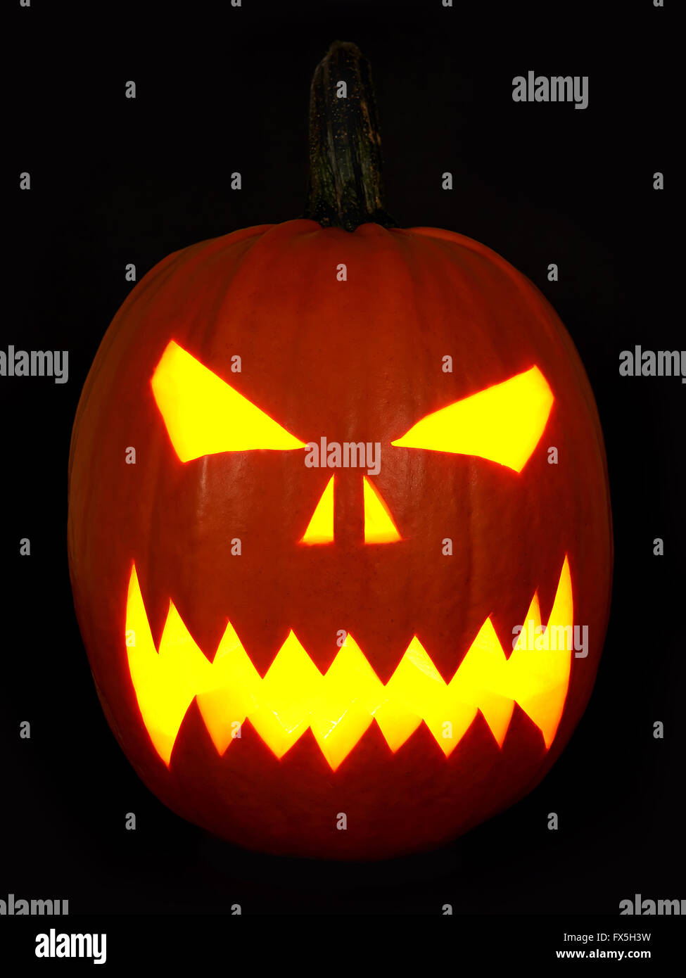 Scary Halloween mask made of a  orange pumpkin Stock Photo