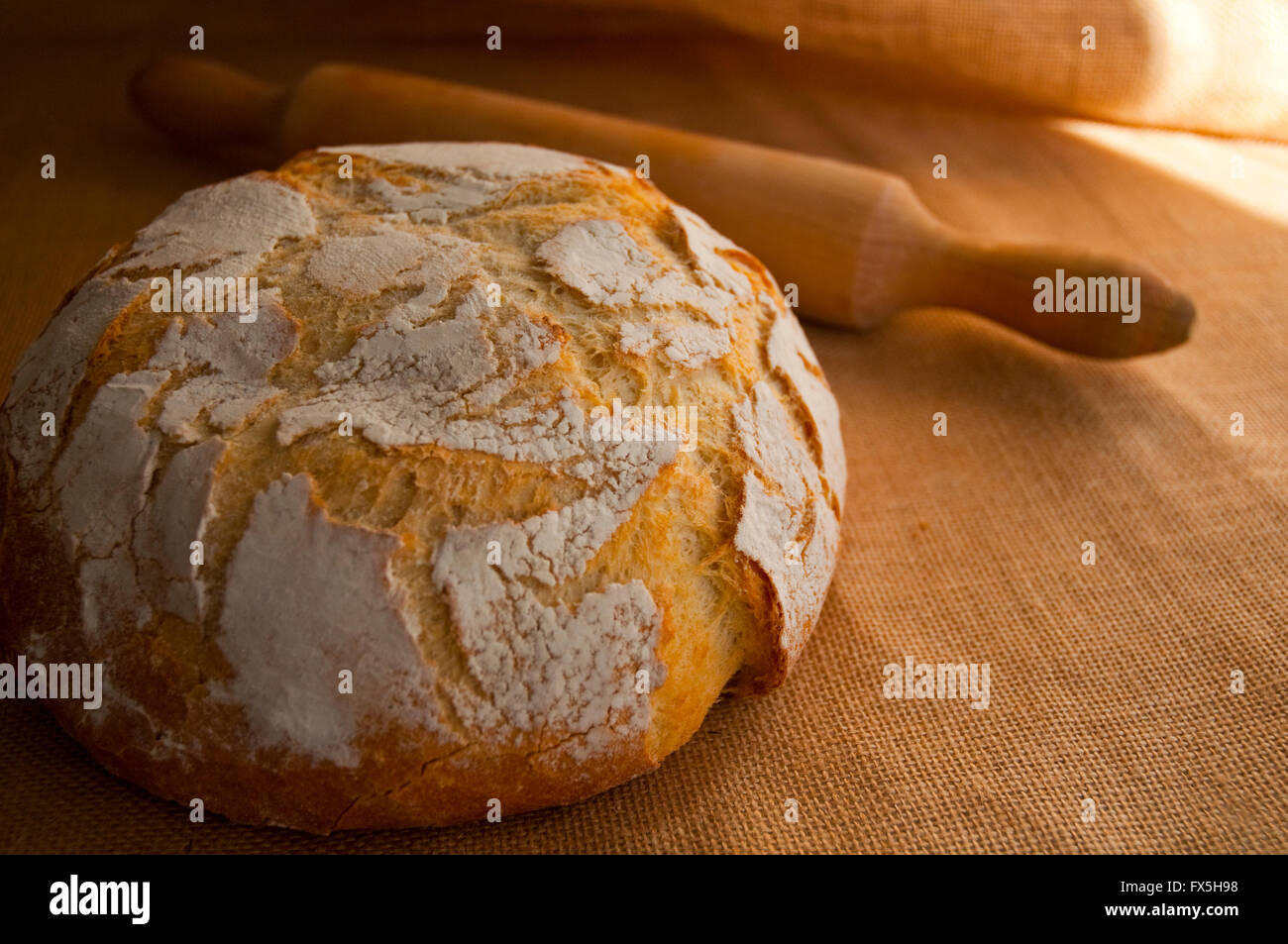 Bread loaf and rolling pin. Stock Photo