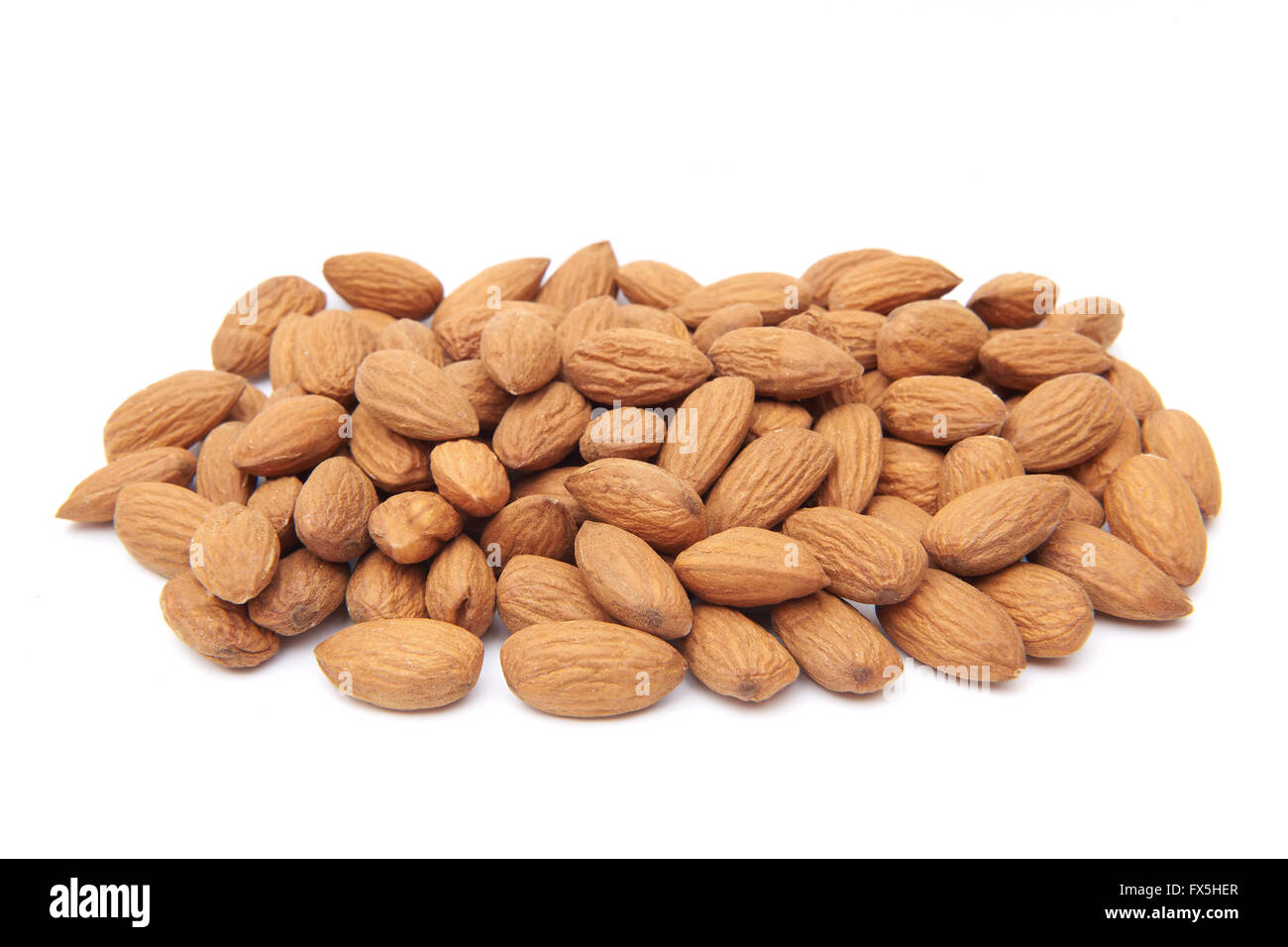 Closeup image of unshelled almonds isolated on a white background Stock Photo