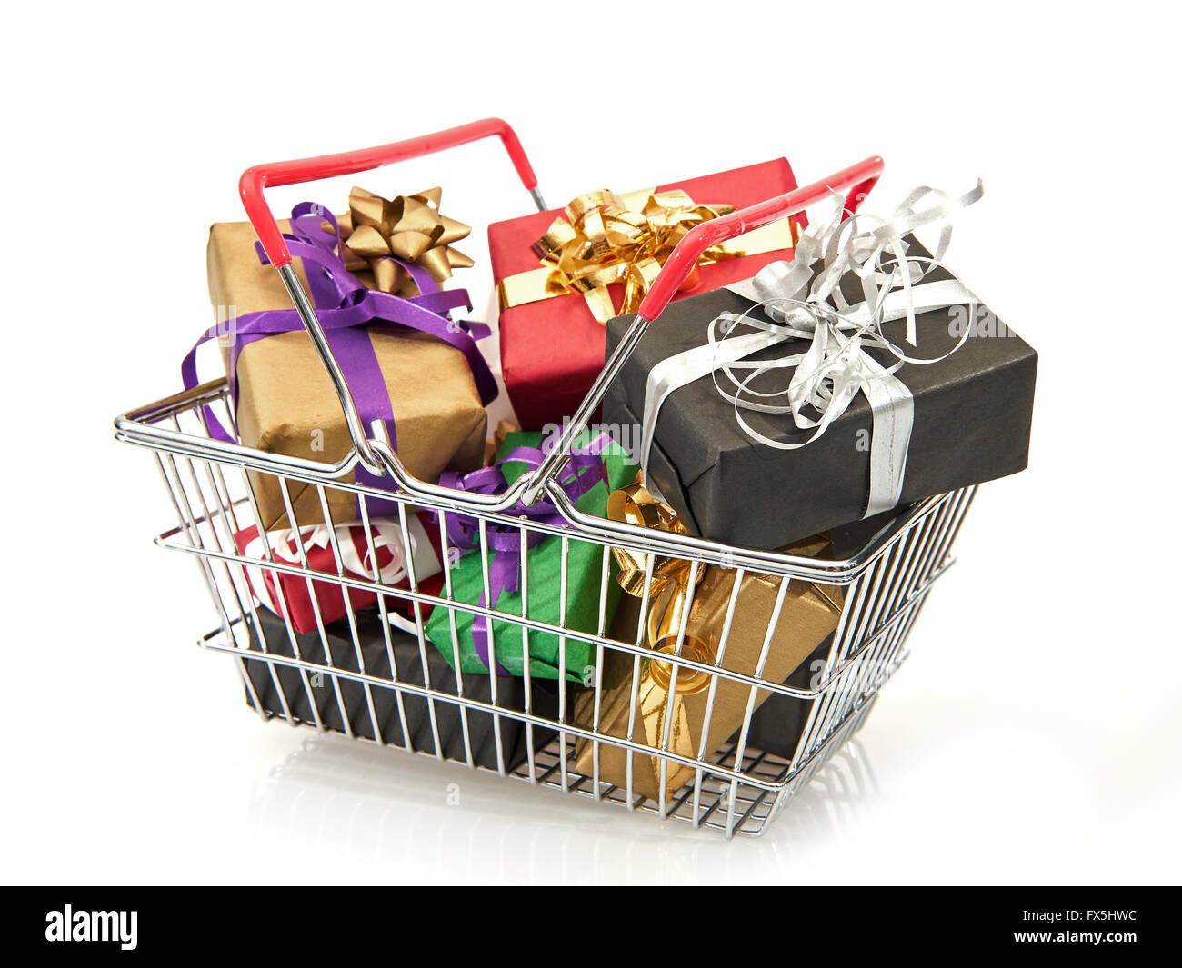 Shopping basket filled with colourful christmas presents Stock Photo