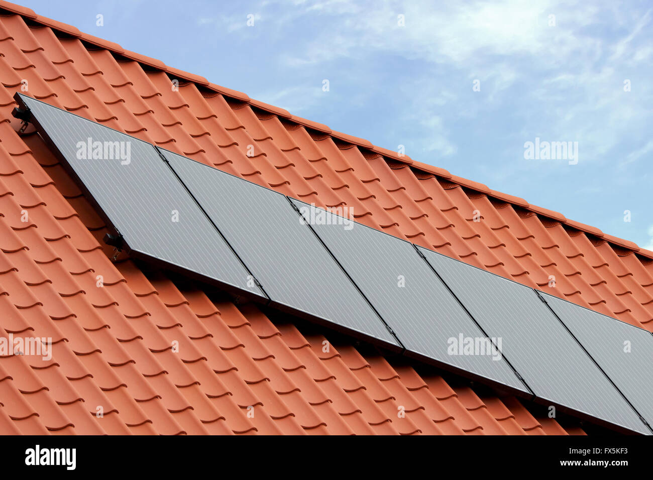 Flat plate solar thermal collectors on a red tile roof Stock Photo - Alamy
