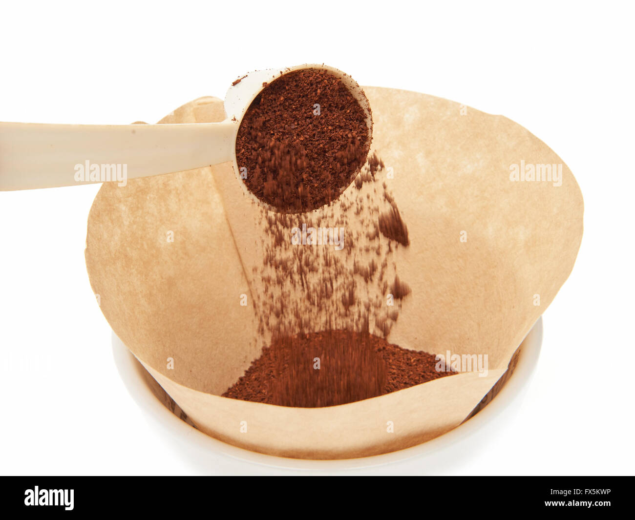 Coffee measuring scoop putting grinded coffee in a filter Stock Photo Alamy