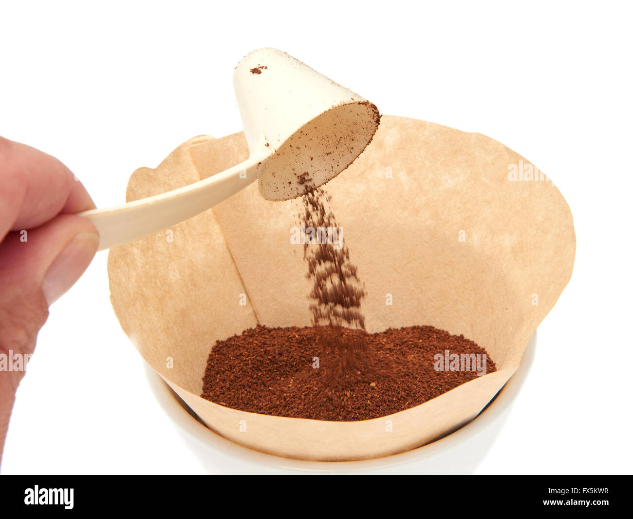 Coffee measuring scoop putting grinded coffee in a filter Stock Photo Alamy