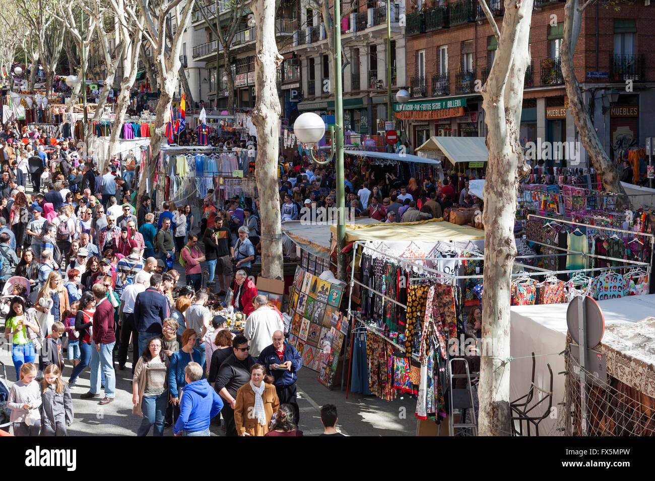 People walking through the El Rastro flea market in Madrid, Spain Stock Photo