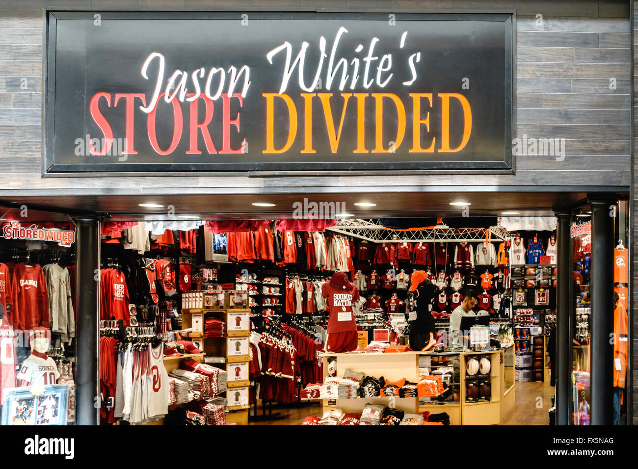 A sports clothing store selling rival college attire. Jason White, Heisman winner's  business. Penn Square mall, Oklahoma City, Oklahoma, USA.. Stock Photo