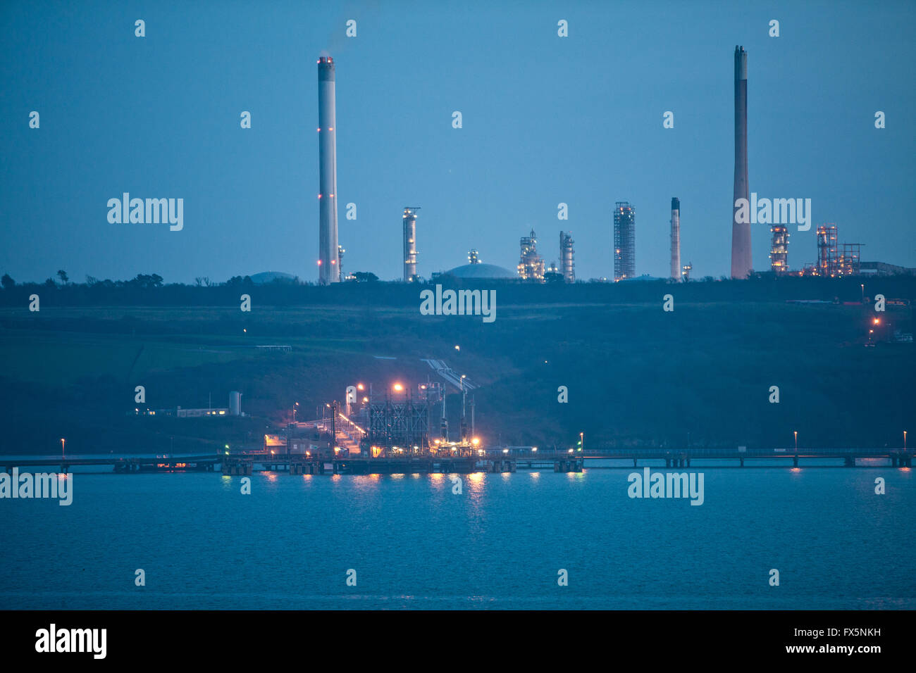 Milford Haven oil refinery taken from Pembroke, Pembrokeshire. Wales now has a coastal path the entire length of its coastline. Stock Photo