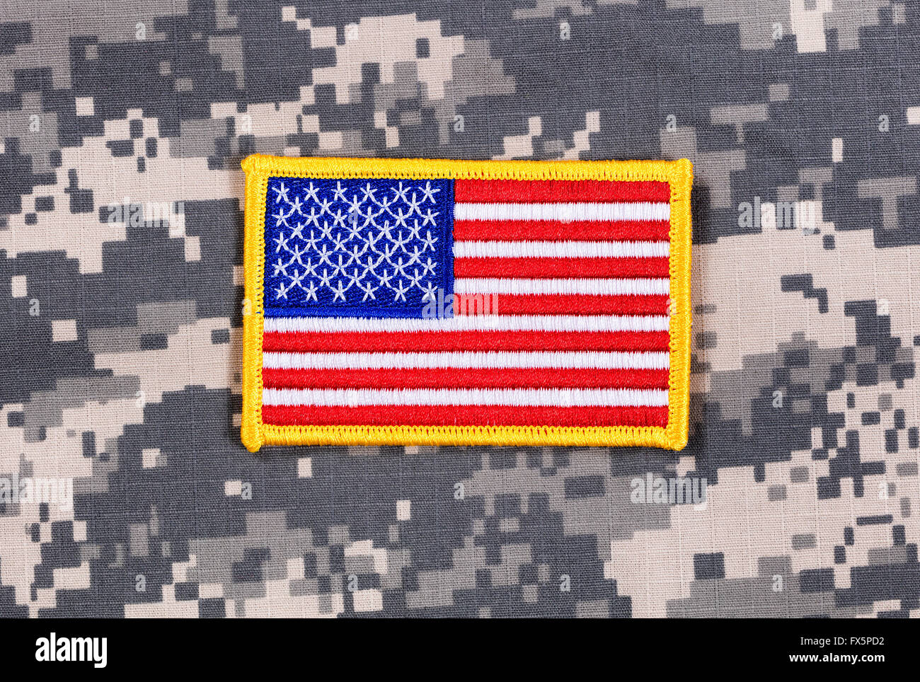 USA flag patch with yellow trim on military battle dress uniform. Stock Photo