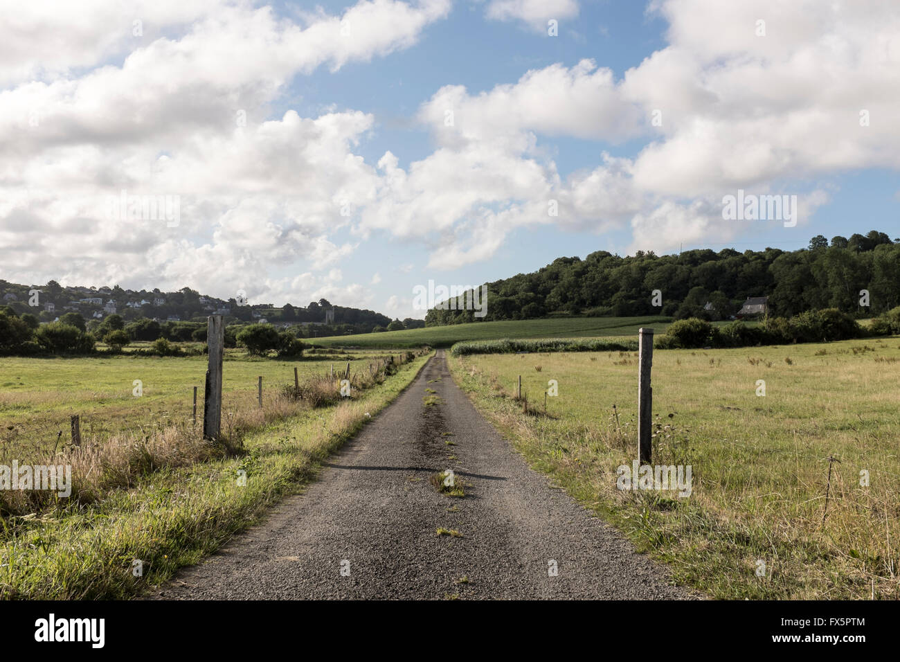 A deserted road leads off into the distance in Britanny, France Stock Photo