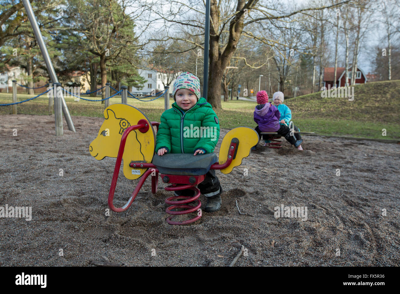 Children playing on a playground Stock Photo