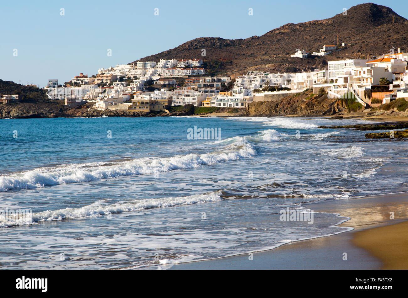 Beach and waves at San José, Cabo de Gata natural park, Almeria, Spain Stock Photo