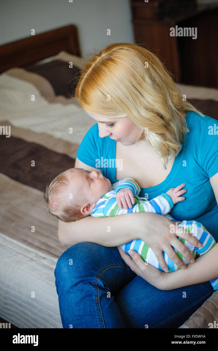 Mother keeps a little baby boy in her arms Stock Photo Alamy