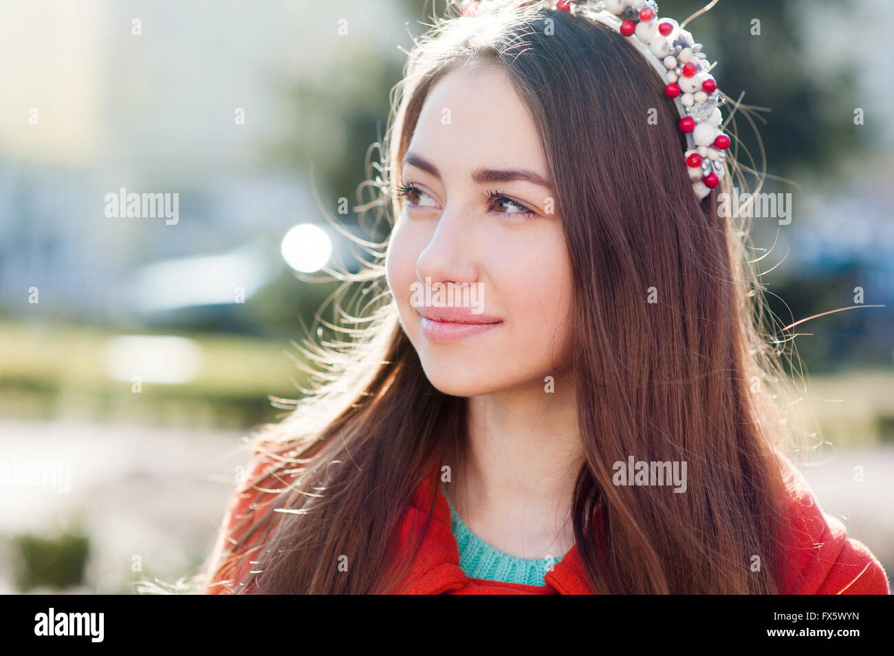 portrait of a beautiful woman in an orange coat Stock Photo - Alamy