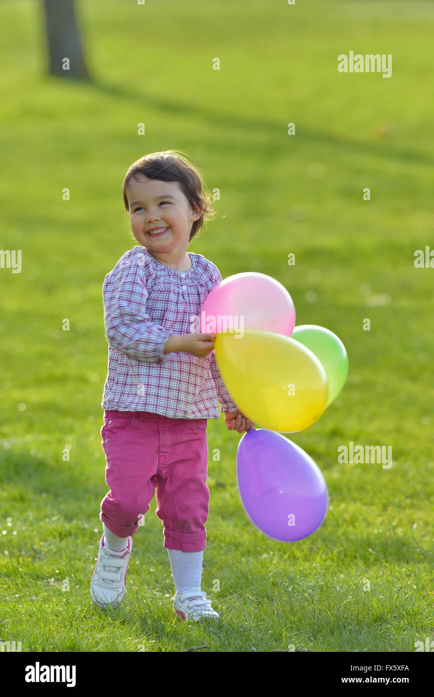 Portrait of a girl with colorful balloons Stock Photo