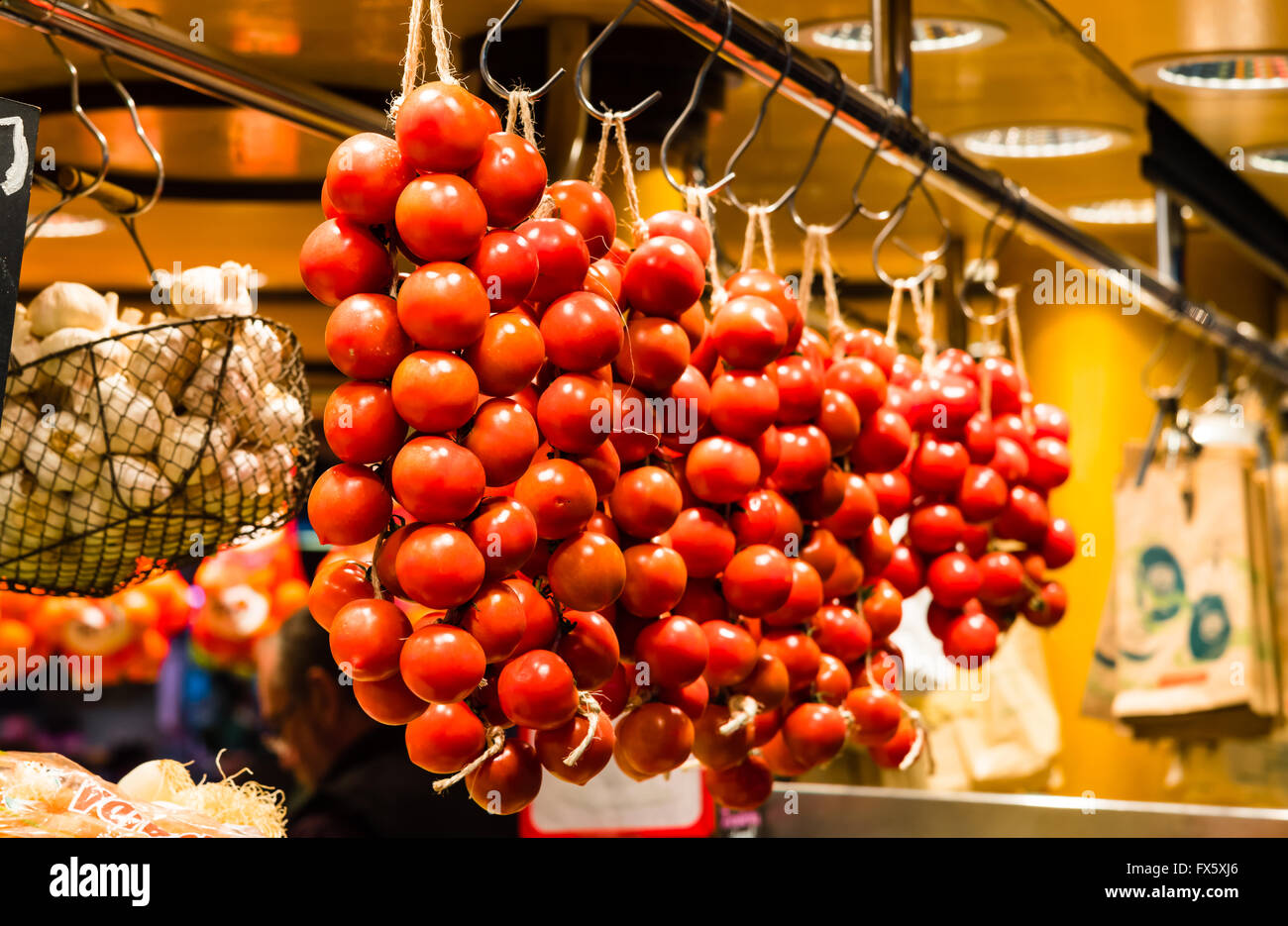 organic red tomatoes on display on a local market Stock Photo