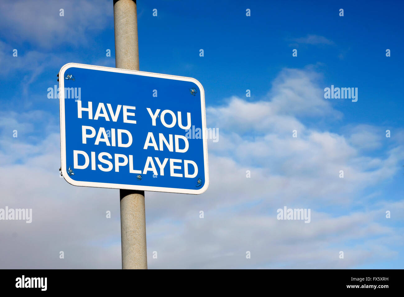 Pay and Display sign against a blue sky Stock Photo