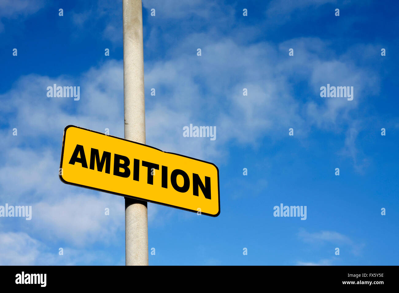 Yellow Ambition sign against a blue sky Stock Photo