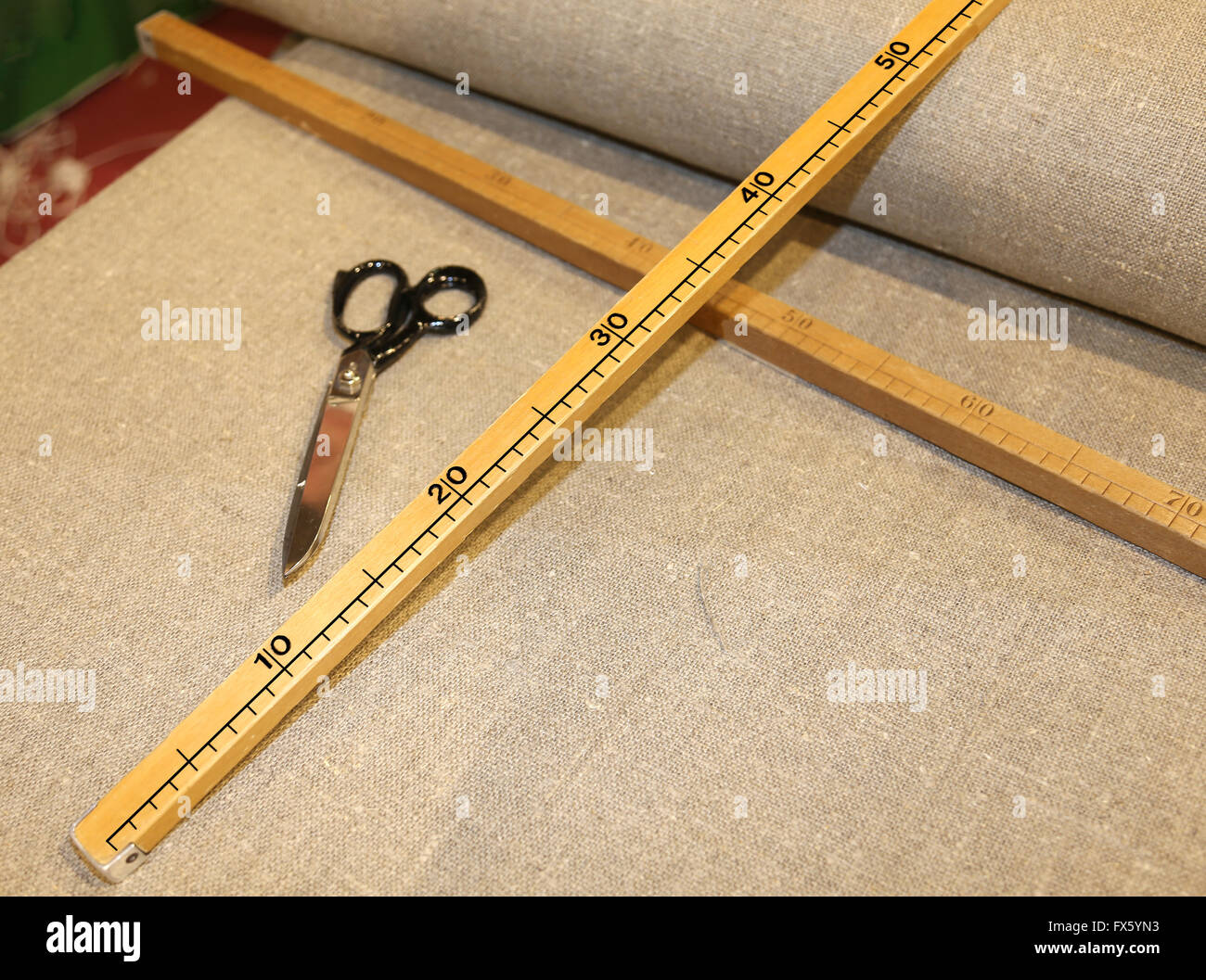 large tailor's scissors with the wooden meter in the Italian artisan