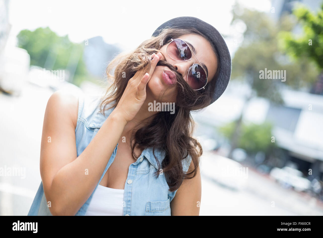 Young woman pulling funny faces Stock Photo
