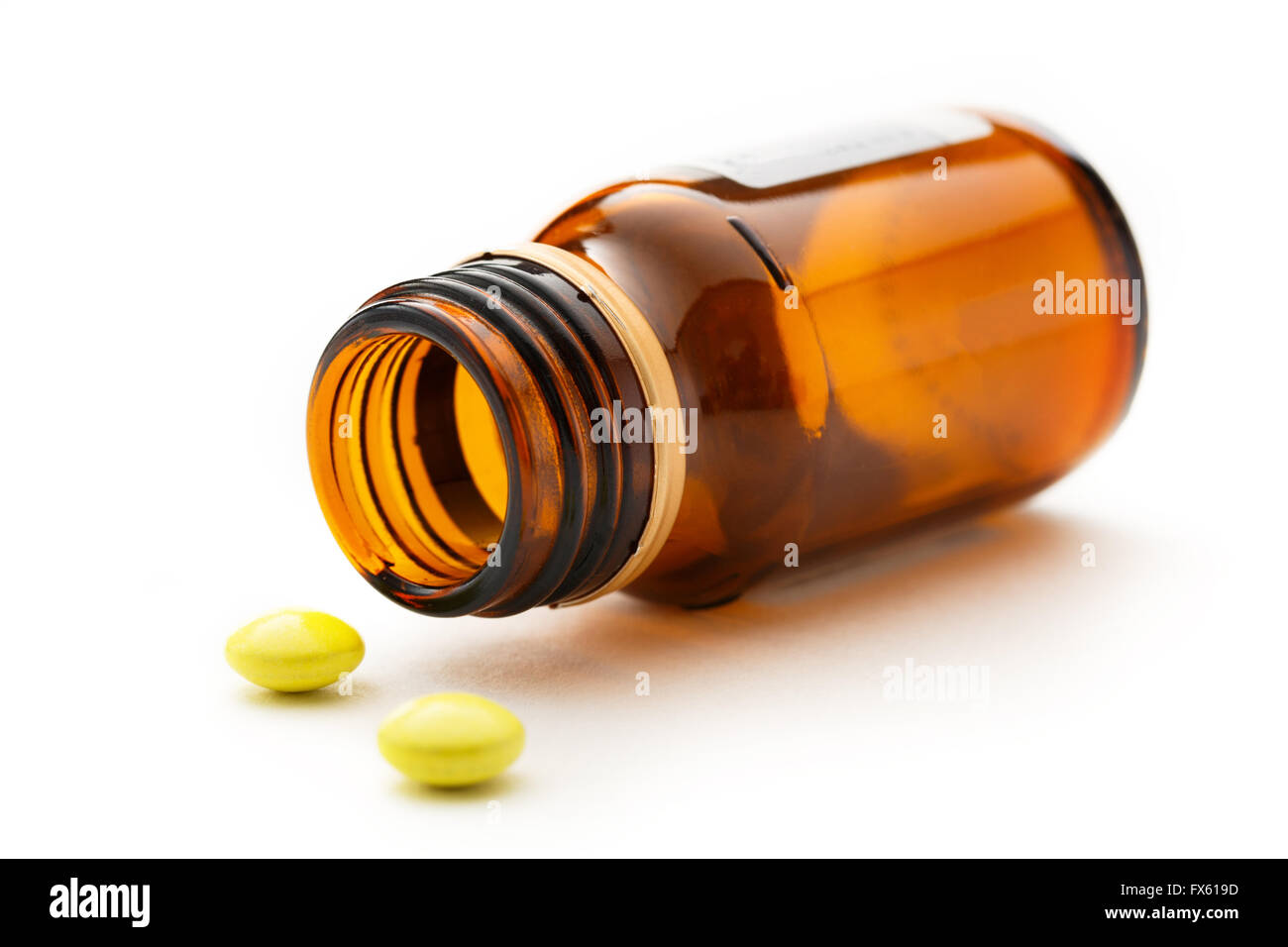 Bottle with pills in closeup on white Stock Photo