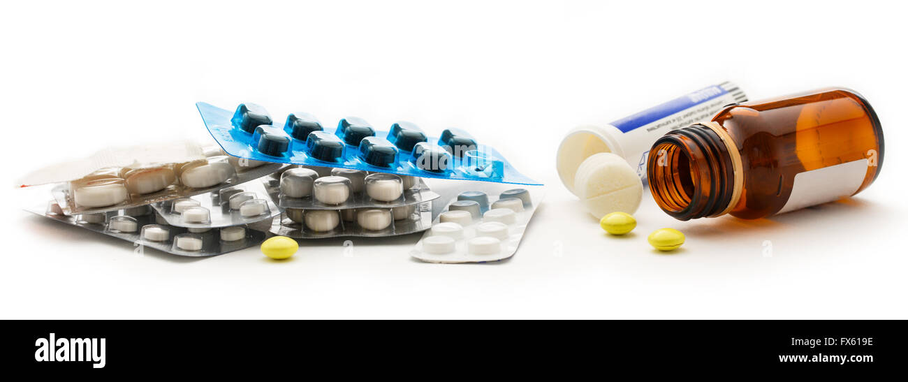 Bottles with pills in closeup on white Stock Photo