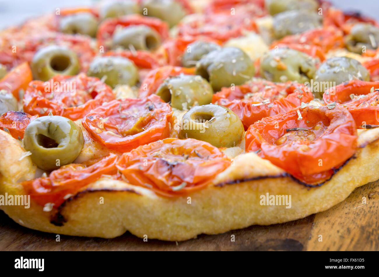 Focaccia pizza with green olives and cherry tomatoes Stock Photo Alamy