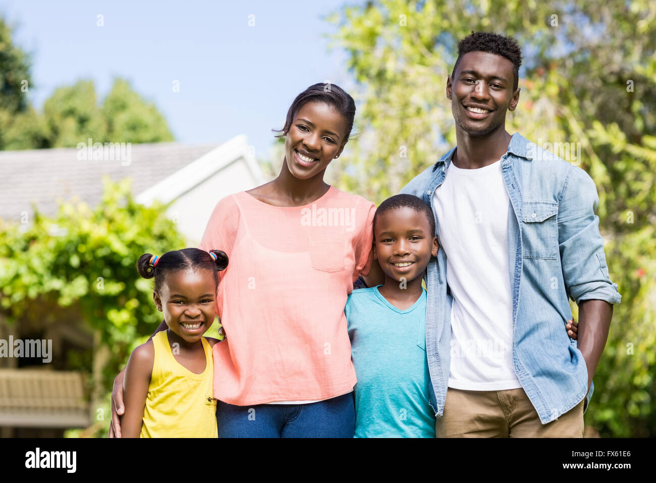 Happy family posing together Stock Photo - Alamy