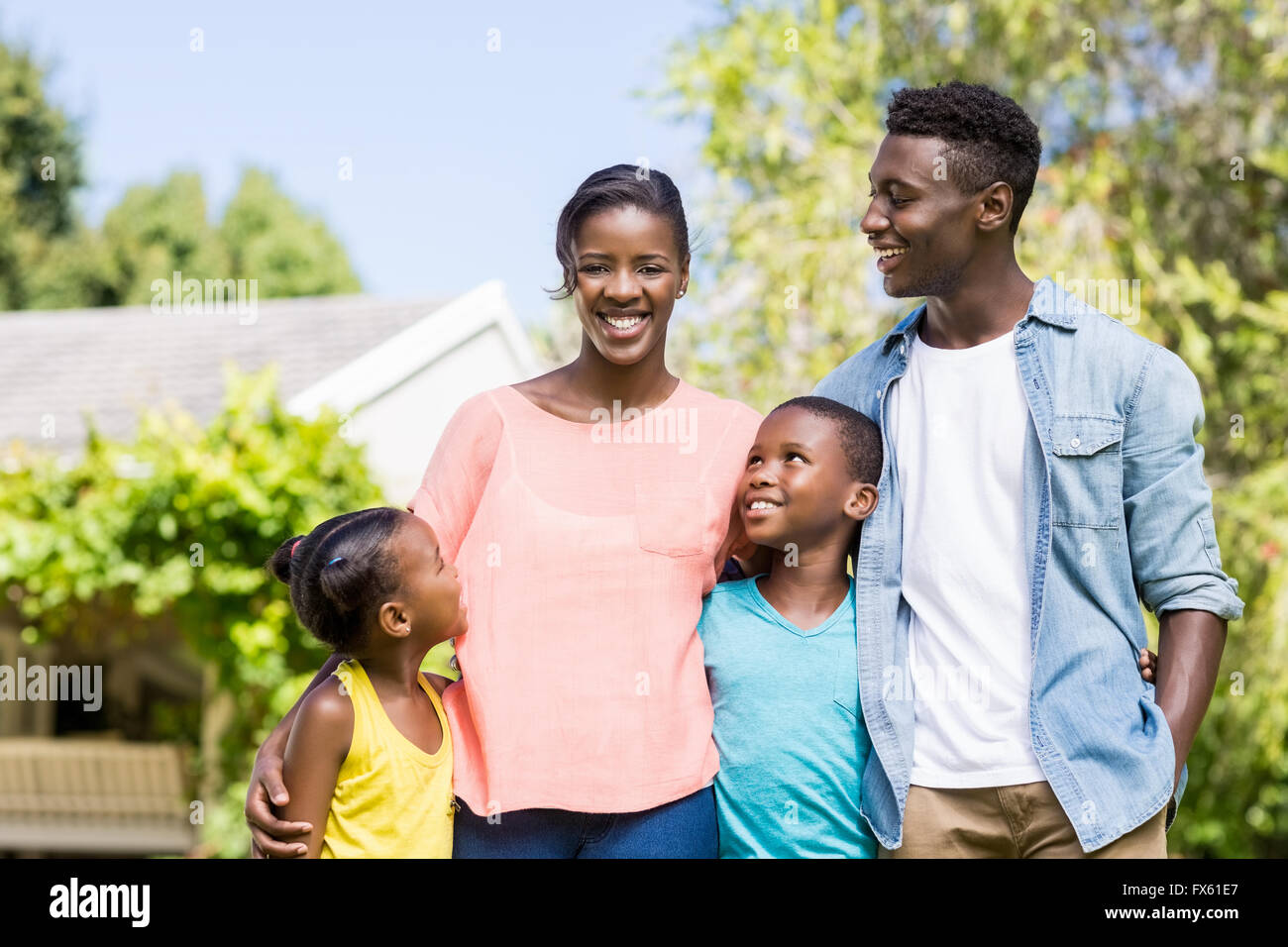 Happy family posing together Stock Photo - Alamy