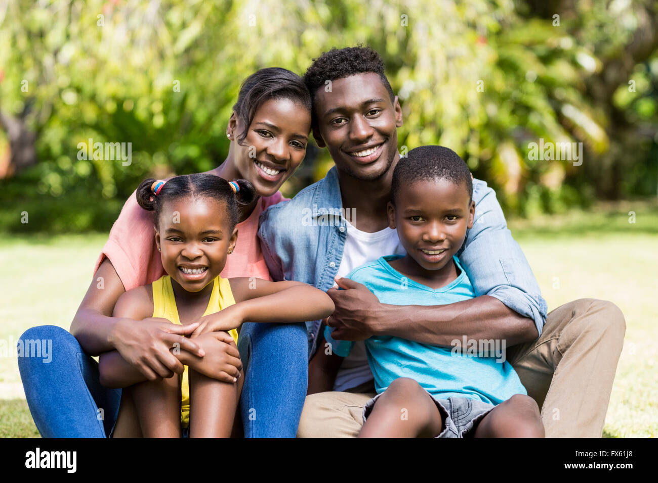 Happy family posing together Stock Photo - Alamy