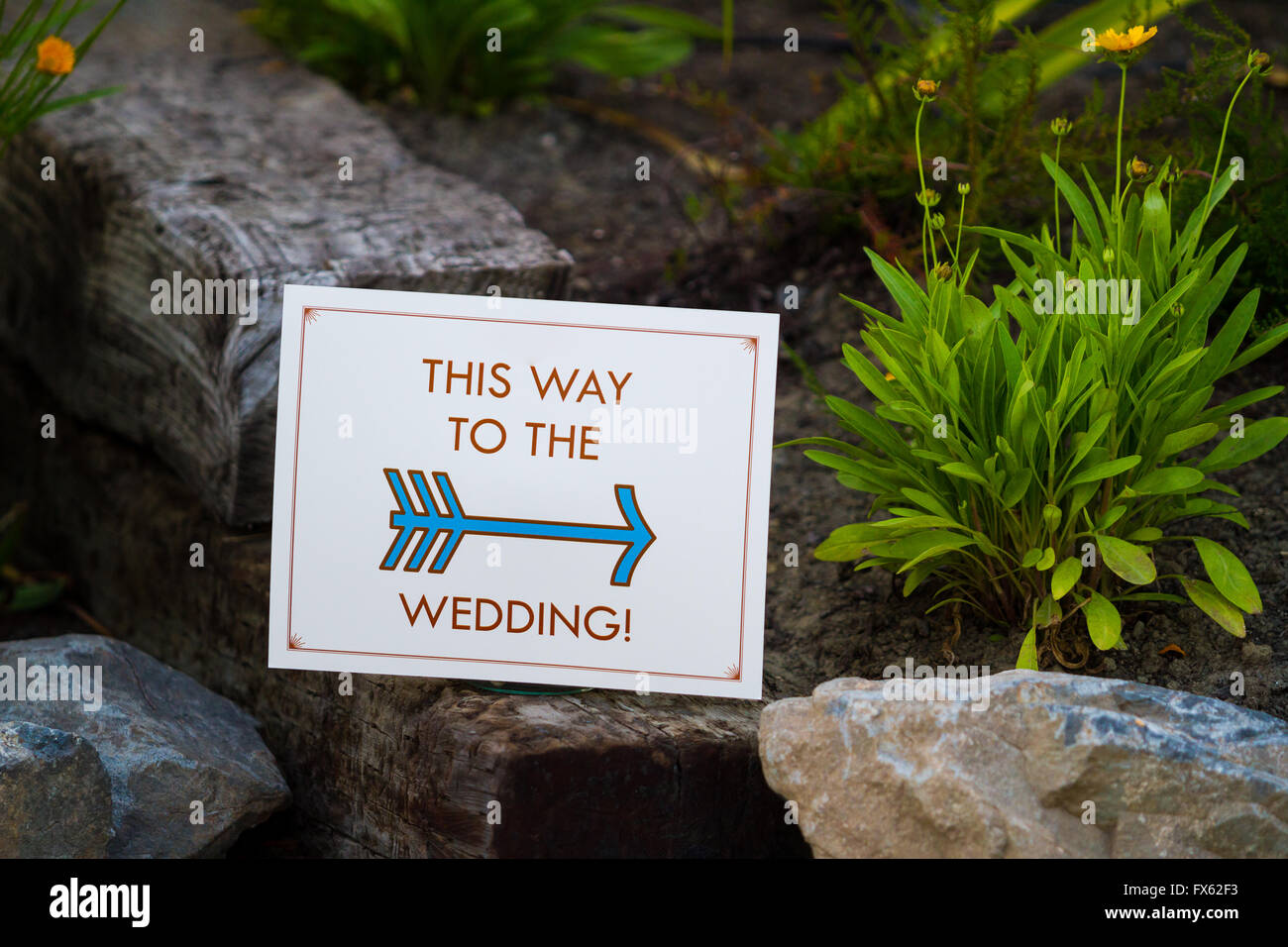 Sign reads this way to the wedding at an outdoor venue in Southern Oregon. Stock Photo