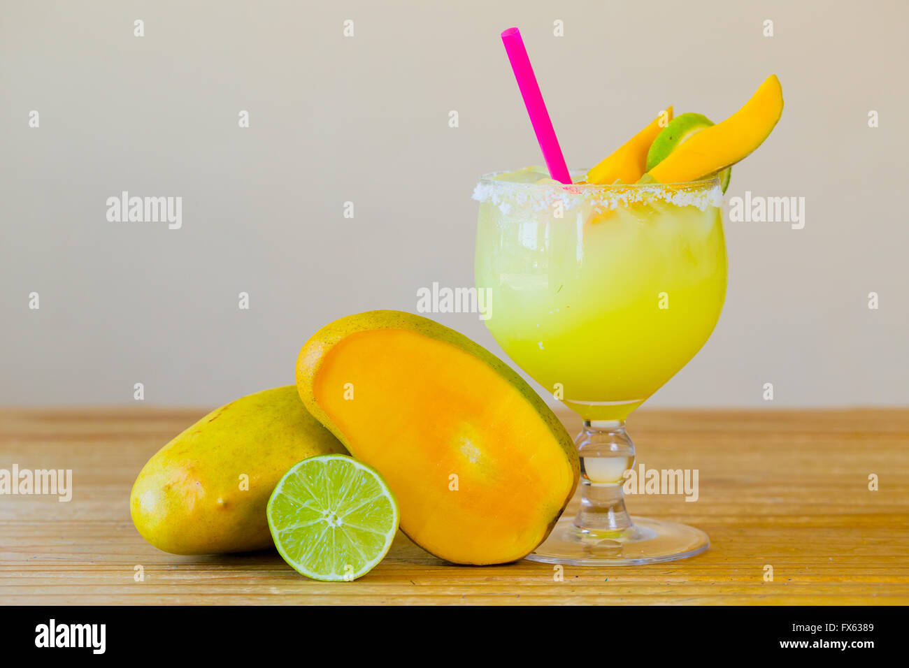 Traditional mango margarita with lime at a Mexican restaurant bar. Stock Photo