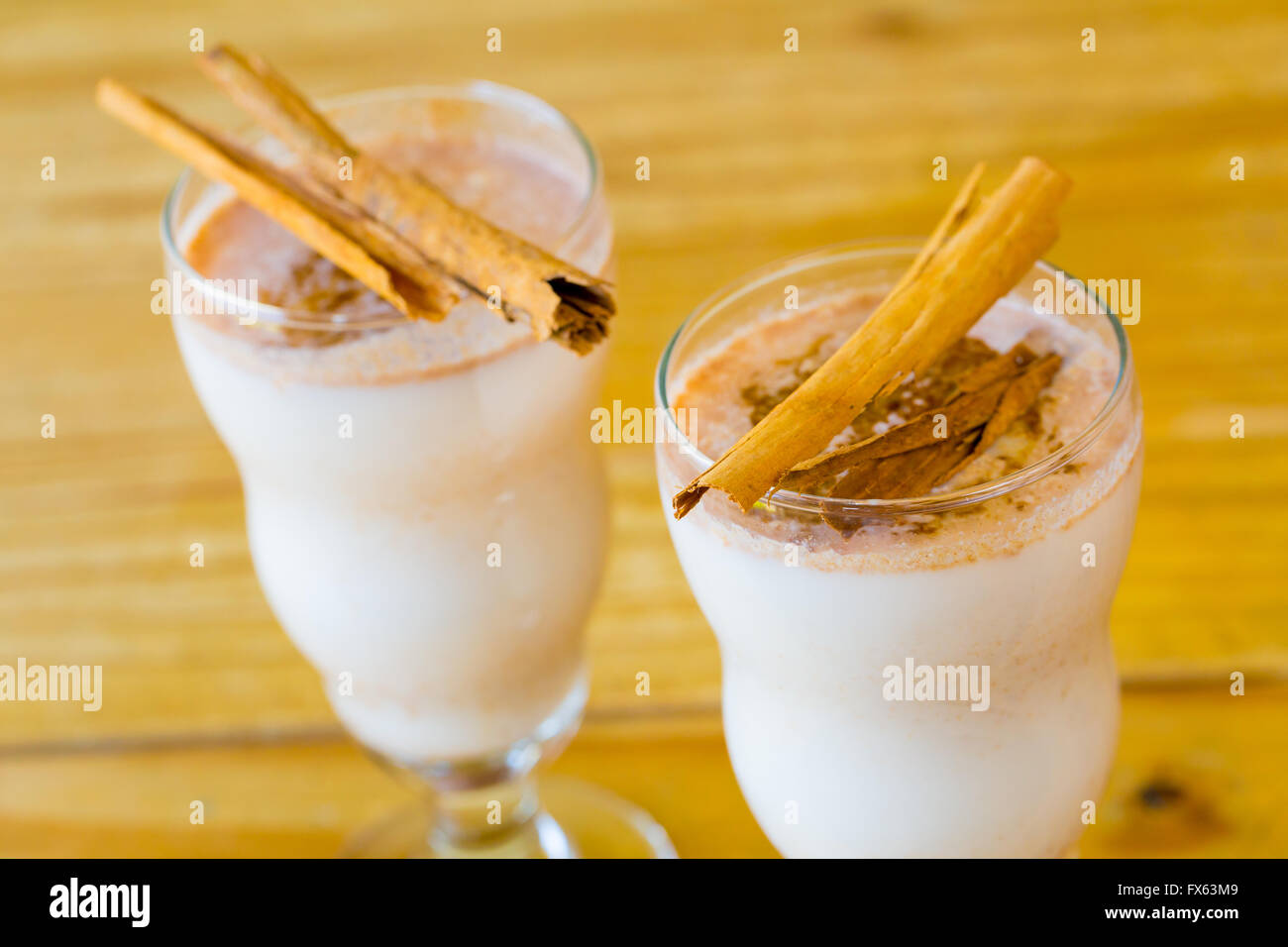 Mexican restaurant bar serving a traditional cinnamon horchata with cinnamon sticks. Stock Photo