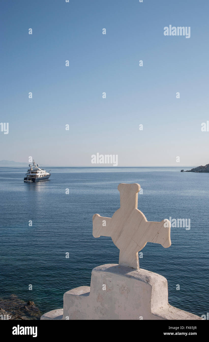 Cross on traditional arch and seascape Stock Photo