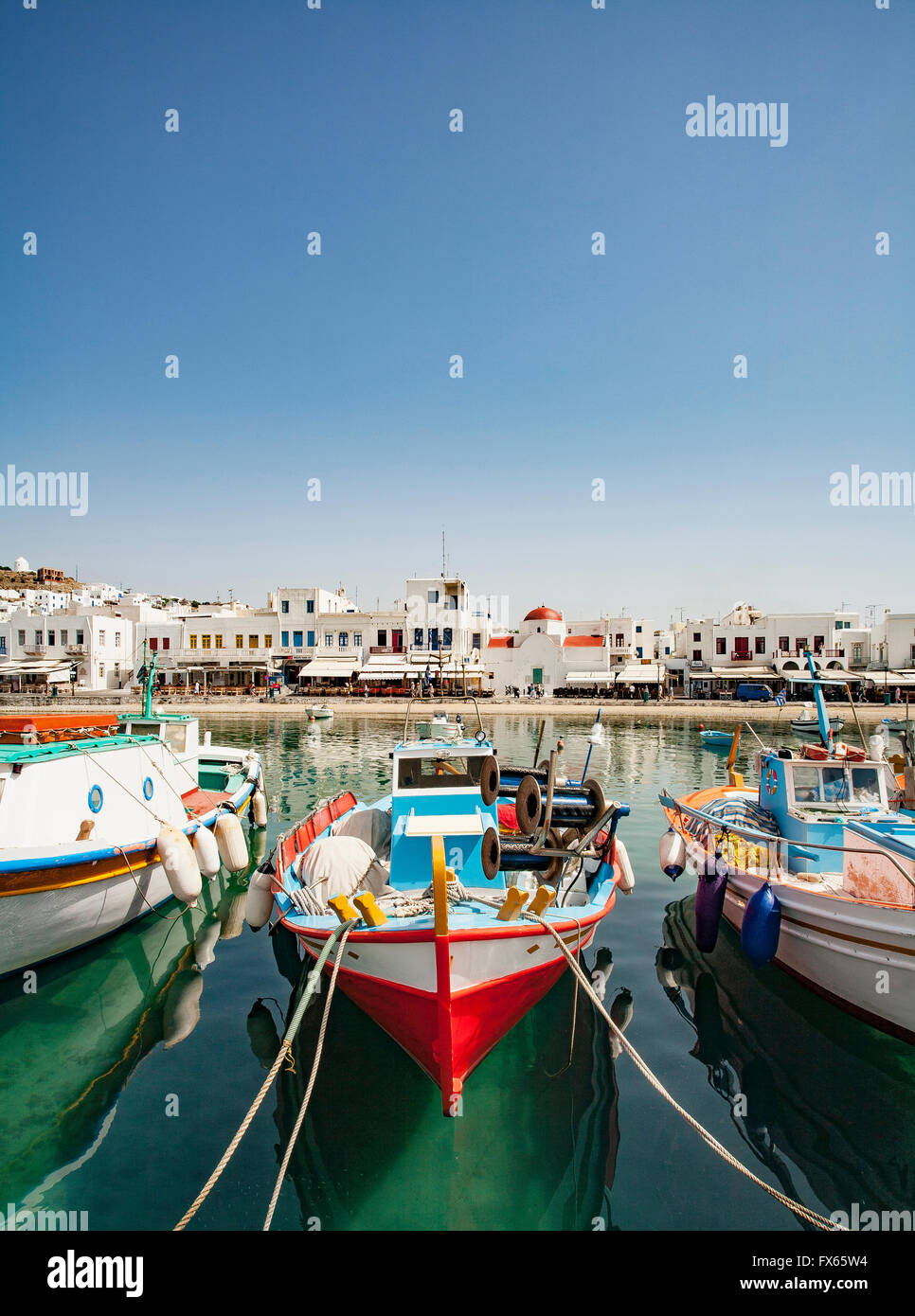 Boats anchored in Mykonos harbor, Cyclades, Greece Stock Photo