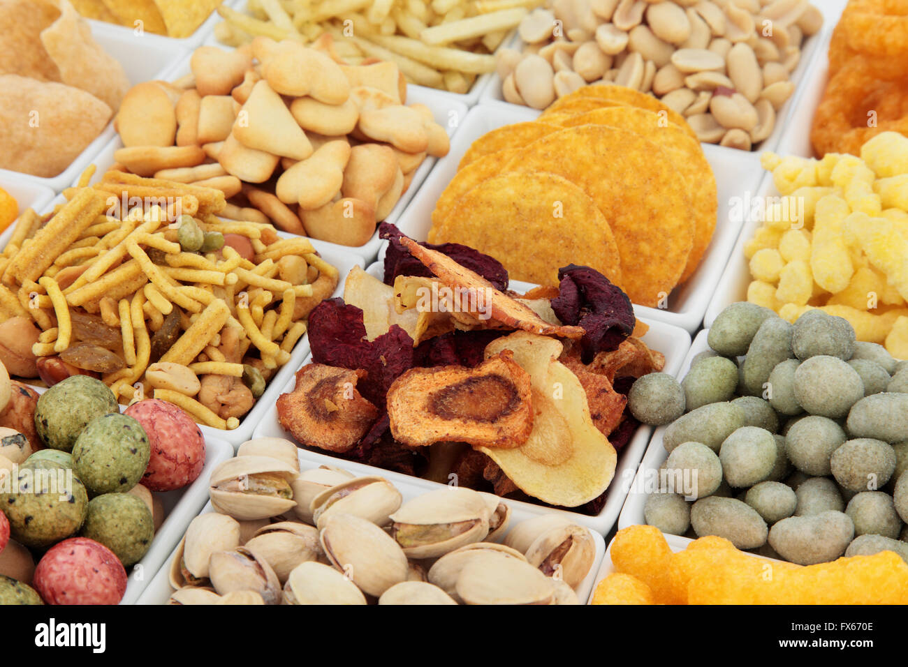 Savory snack party food selection in square porcelain bowls. Selective focus. Stock Photo