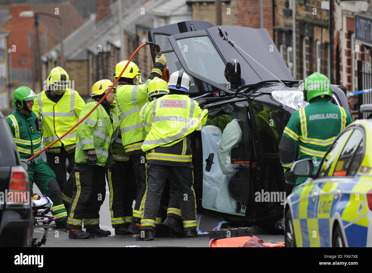 Emergency services cutting the roof off a car involved in an accident. Stock Photo