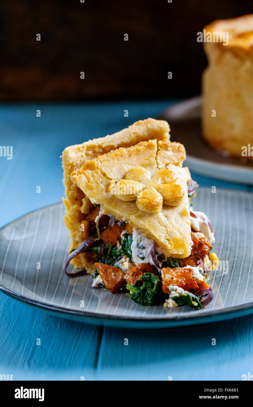 Homemade vegetarian pie with butternut squash, spinach, goat cheese and