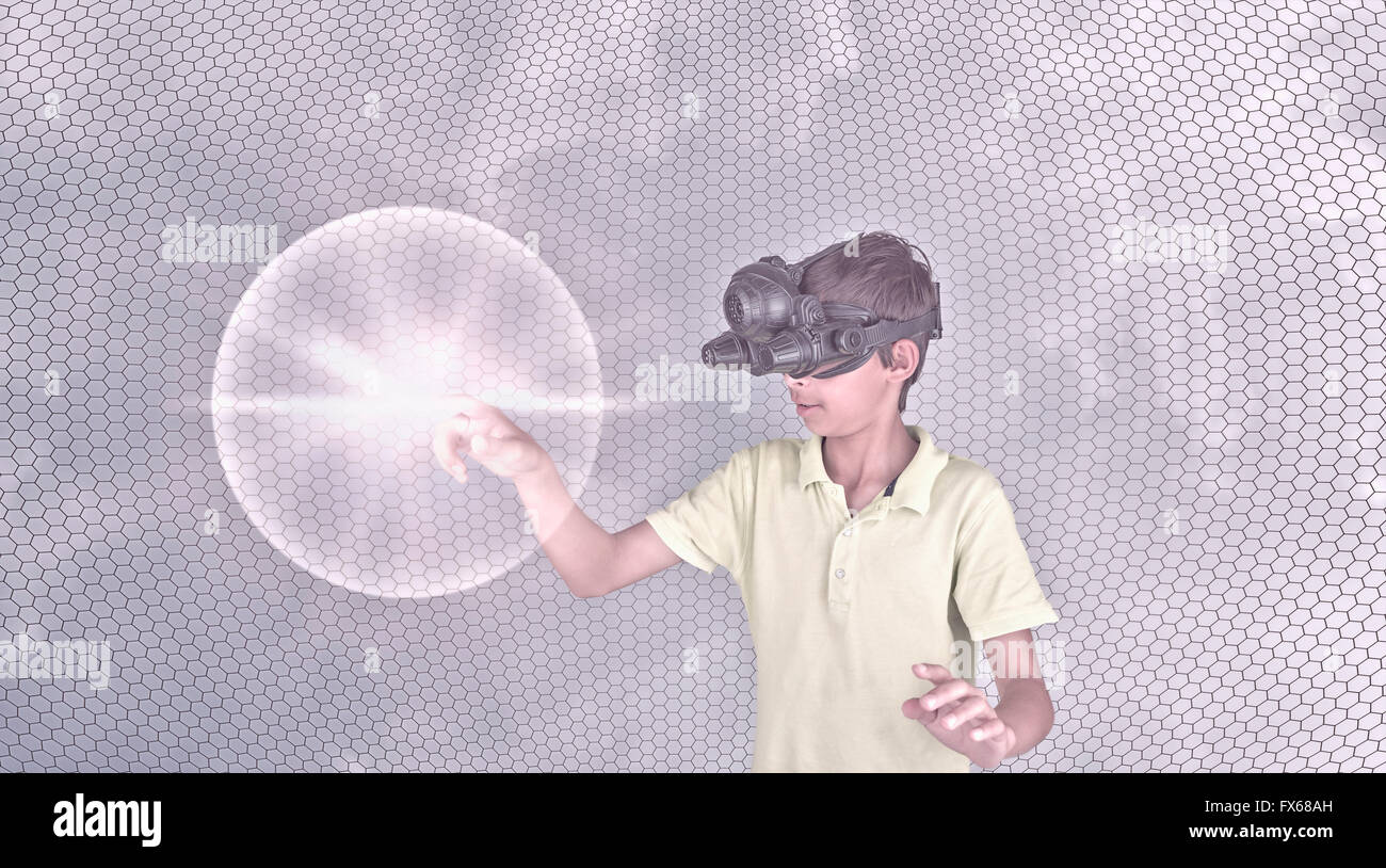 Mixed race boy wearing virtual reality goggles Stock Photo