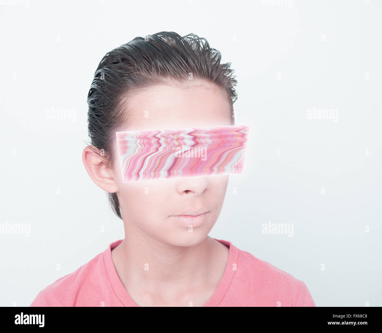 Mixed race boy with glitch covering eyes Stock Photo