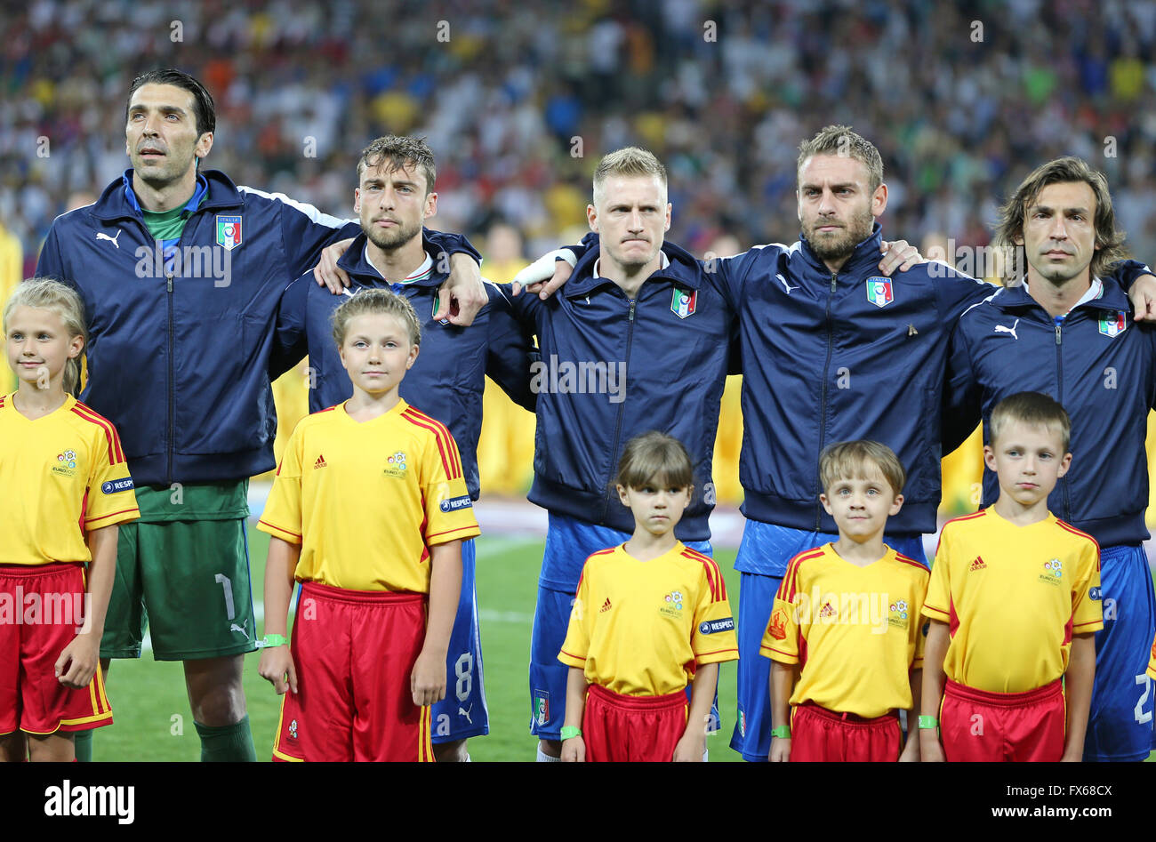 Italy football team players and unidentified young footballers sing the national hymn before UEFA EURO 2012 game against England Stock Photo