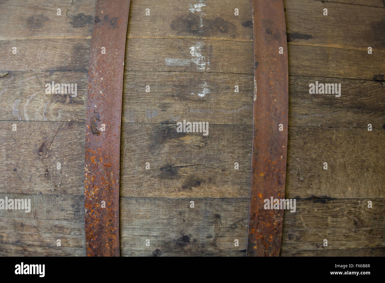 Bourbon barrel at a brewery with aged beer inside. Stock Photo