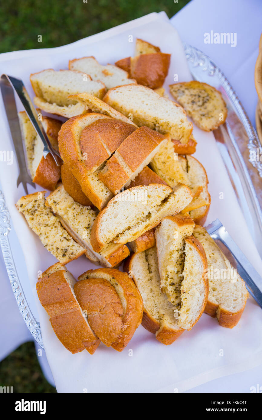 Wedding reception buffet food includes this bread for dinner. Stock Photo