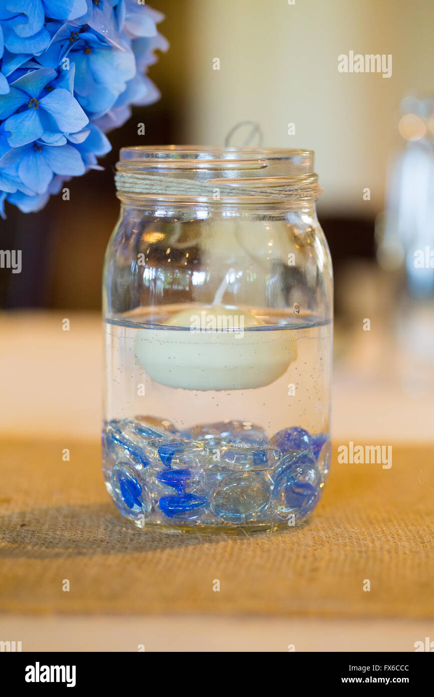 Centerpiece For A Wedding Reception Made Out Of A Floating Candle