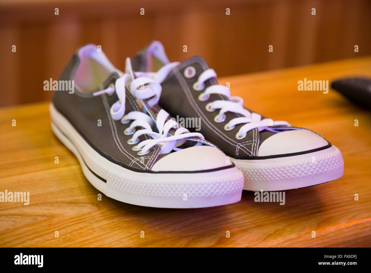 Grey shoes in a converse style to be worn by the groom on his wedding day  Stock Photo - Alamy