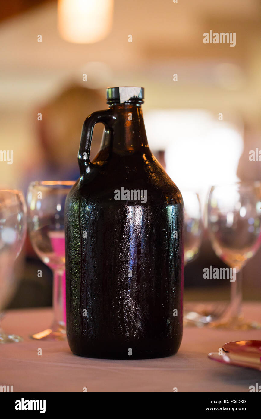 Growler full of craft beer at a wedding reception. Stock Photo