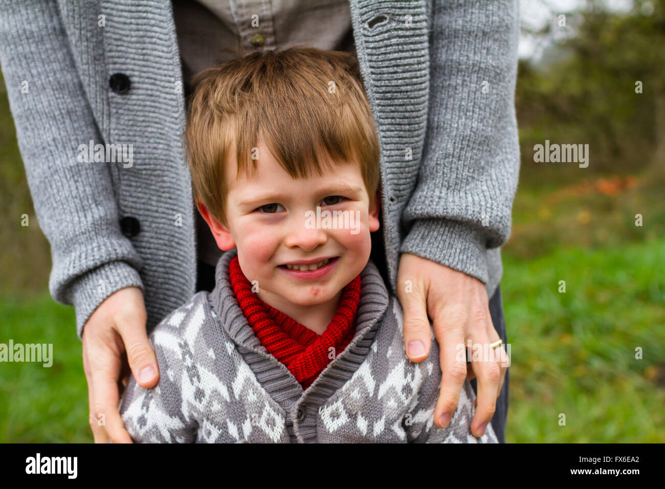 Dad and his son together in a lifestyle family portrait outdoors in the Fall. Stock Photo