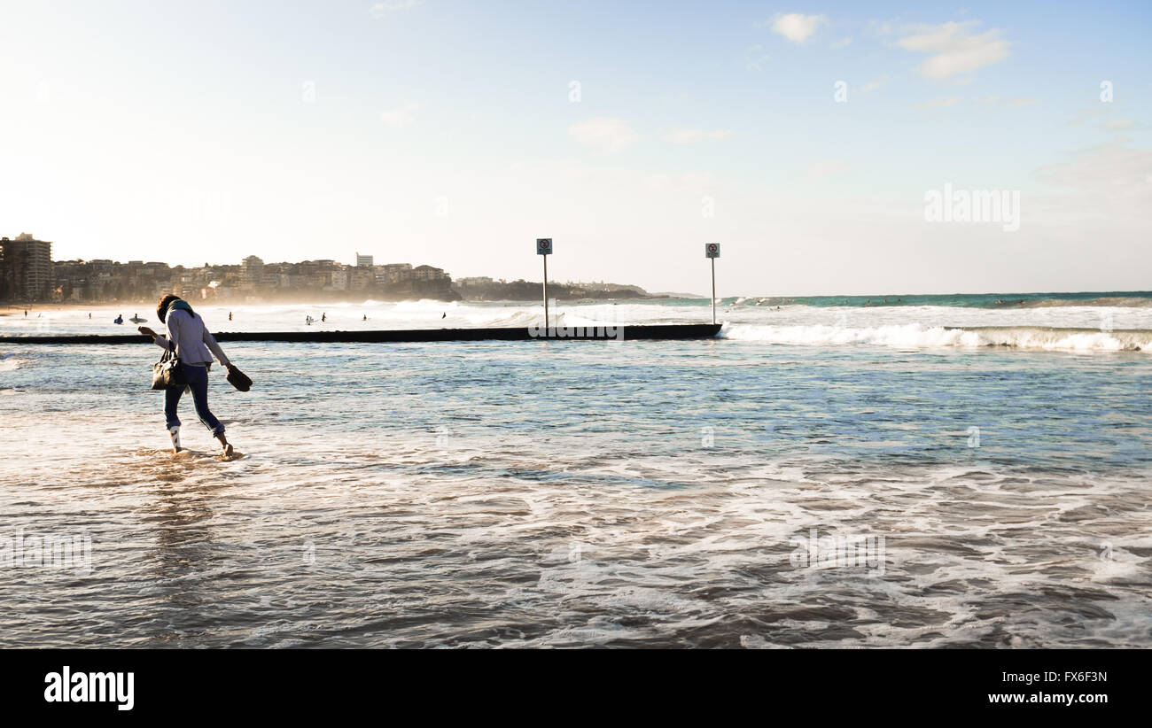 Woman enjoying the sea water at Manly Beach, Sydney, Australia Stock Photo