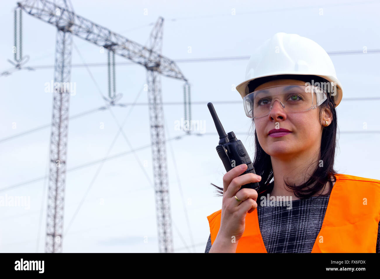 Electrical distribution engineer talking on a walkie- talkie Stock Photo