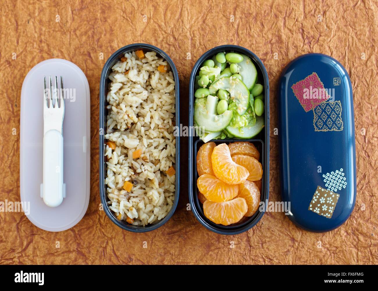 A bento box filled with healthy plant based food, and fork Stock Photo