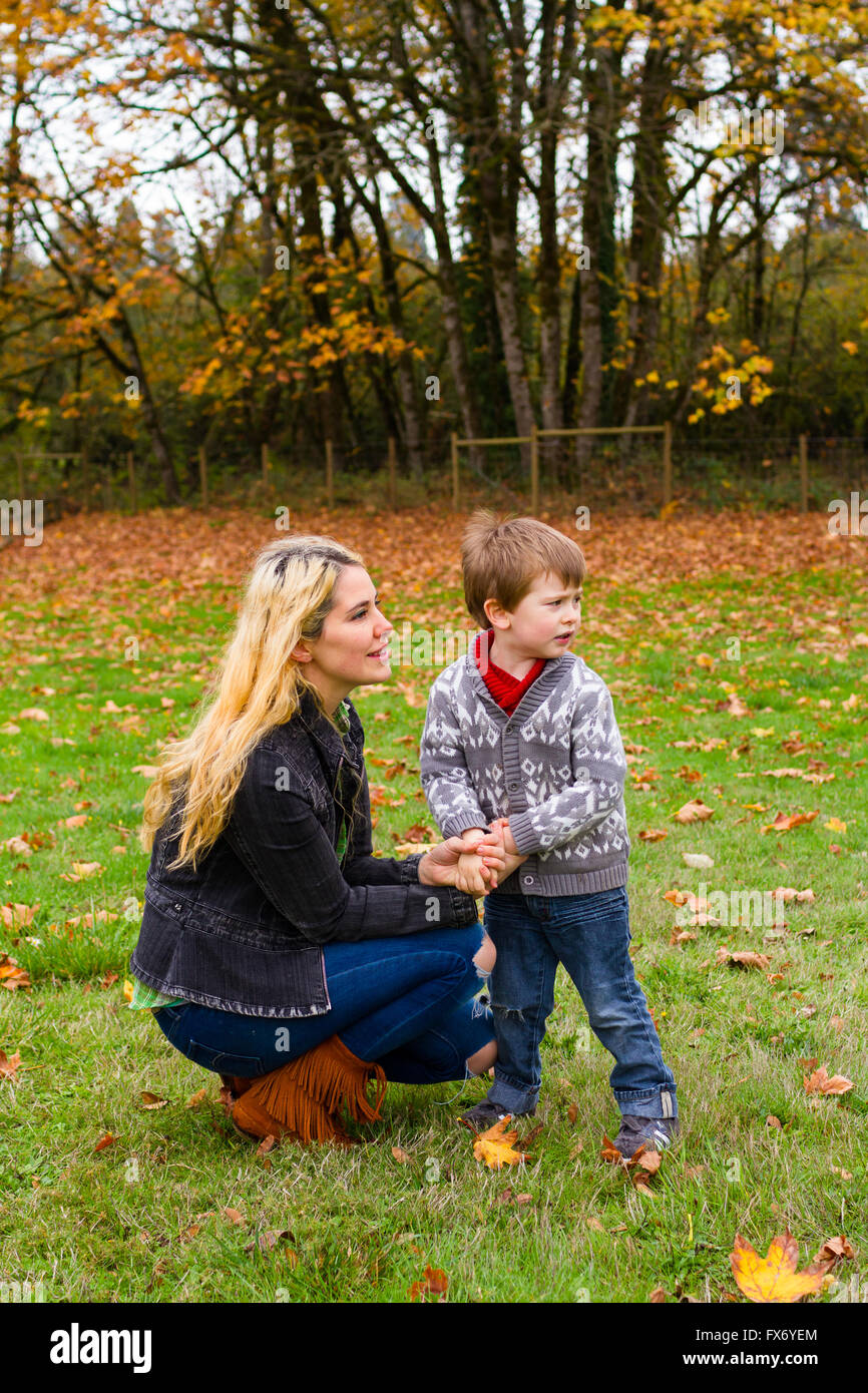 Lifestyle portrait of a mother and her son outdoors in the Fall. Stock Photo