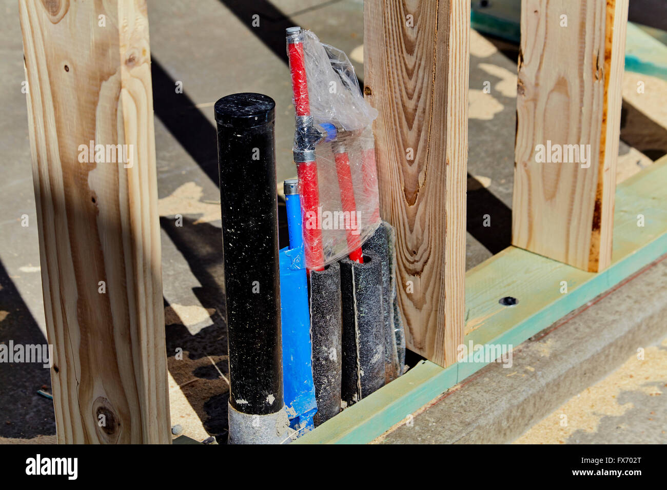 Drain line and water lines in cement floor of new home construction